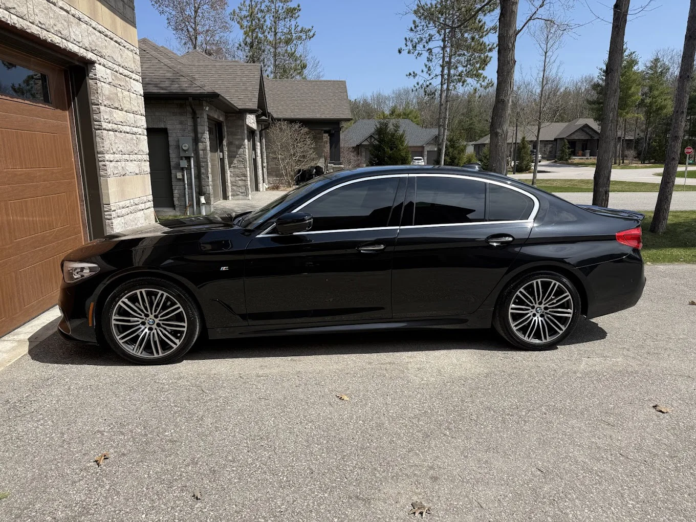 Black BMW with tinted windows by Crystal's Auto Tinting
