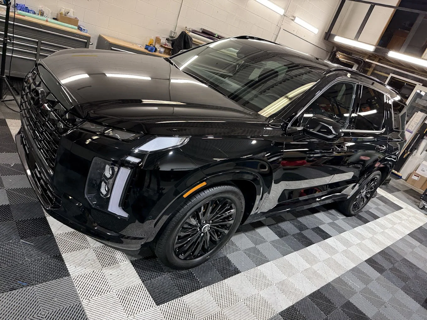Black SUV in the Crystal's Auto Tinting shop
