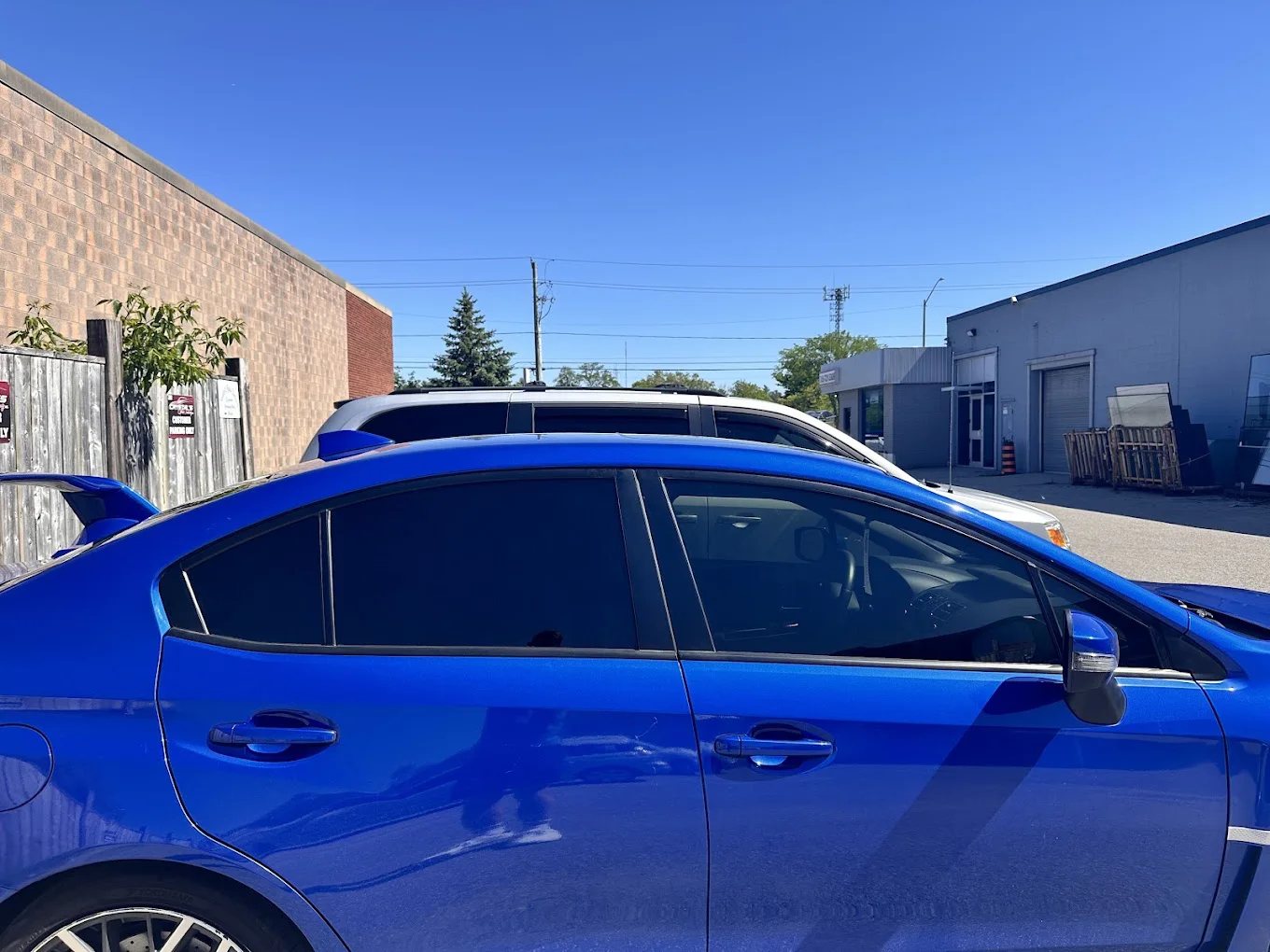 Blue WRX with tinted windows